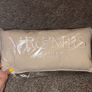 Tan Decorative Pillow with White Embroidery
